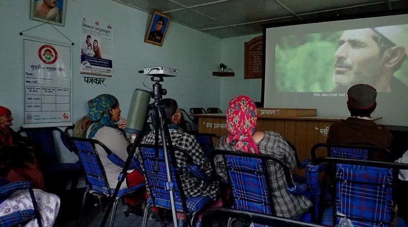 Screening of a film to a small audience in India
