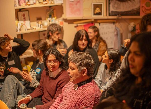 Photograph of people in audience at event in Somer store