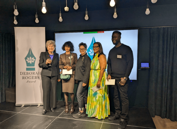 A group of people gathered for photo at an awards ceremony