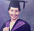 A younger Lucy Stone smiling in her graduation cap and gown