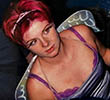 A younger Rebecca Feasey in fancy dress with pink hair