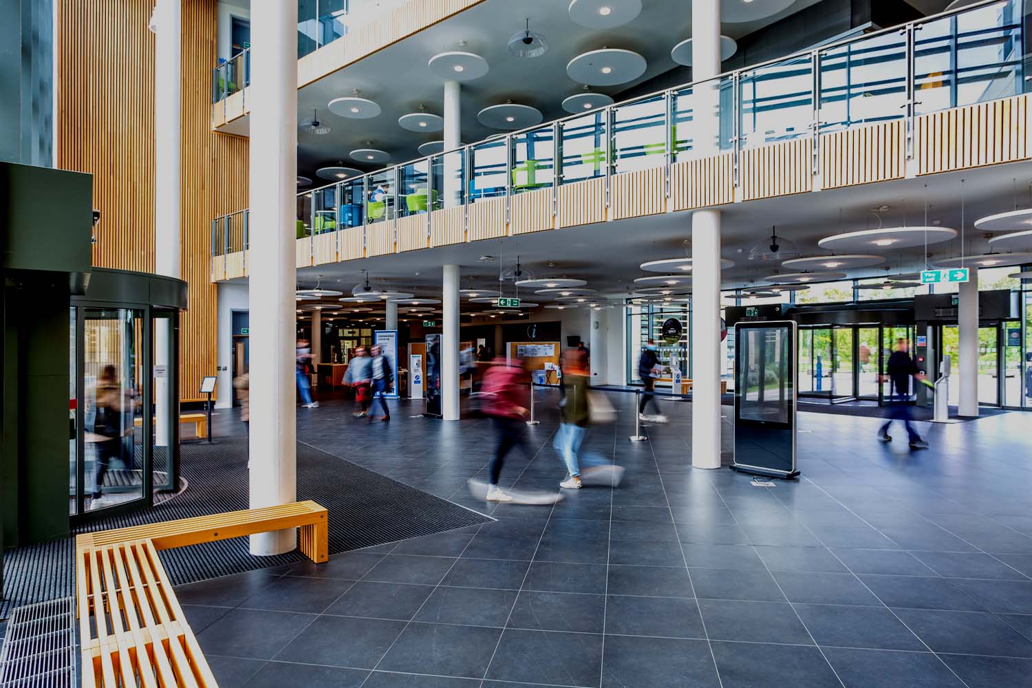 People walking around inside the Commons building