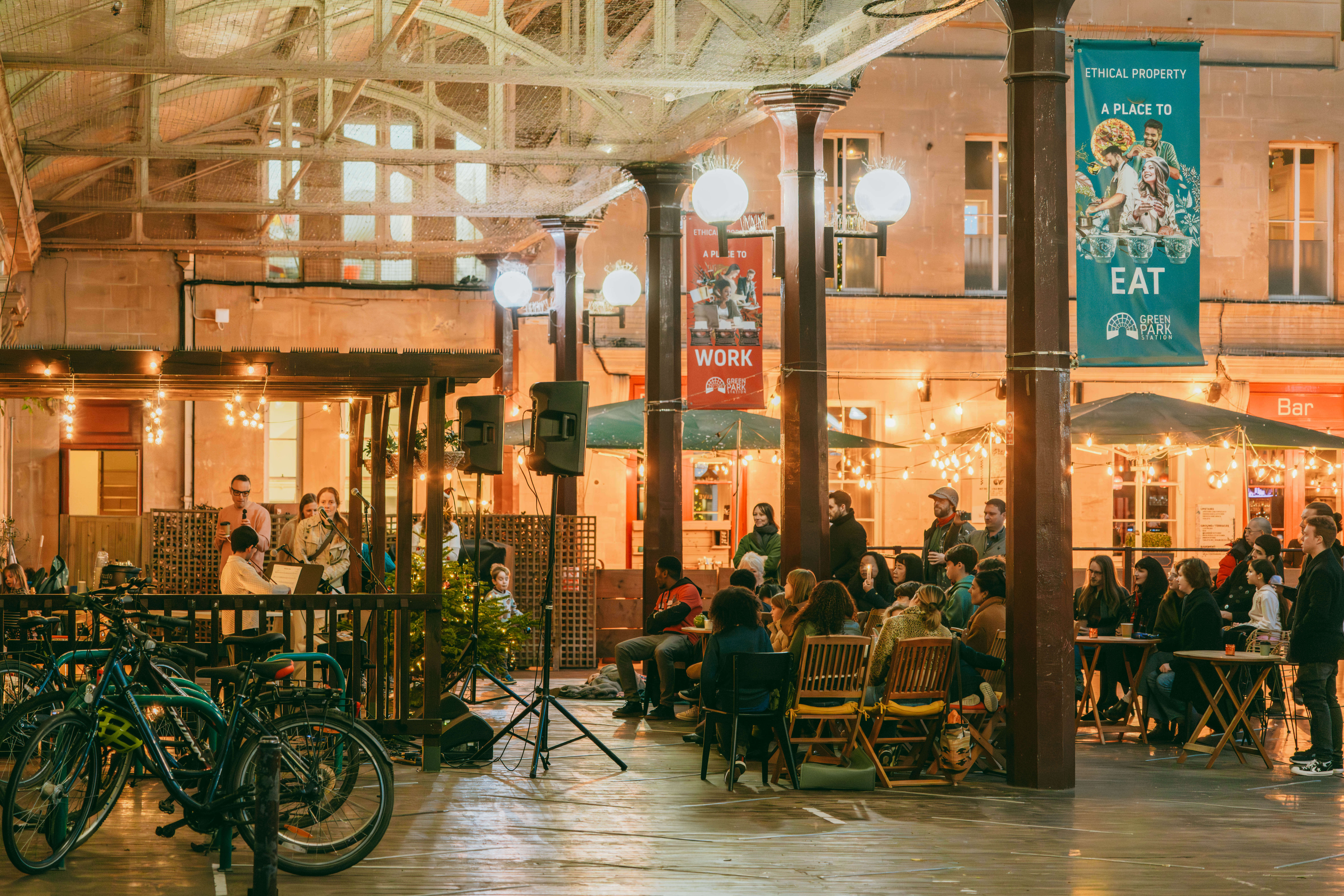 A group of musicians performing to an audience at Music Workshop