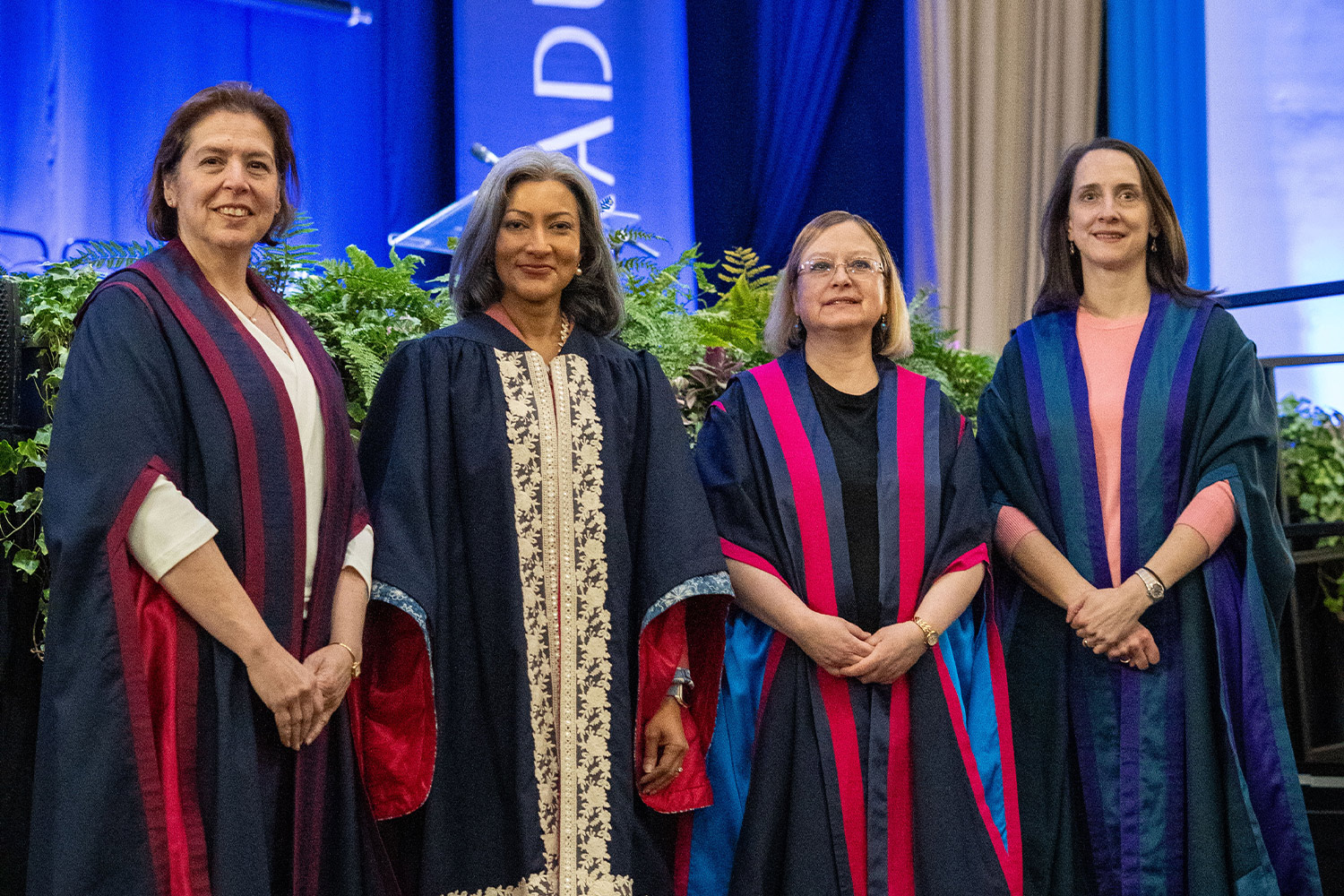 Photograph of Kyriaki, Sharanjit, Georgina and Becky in academic dress