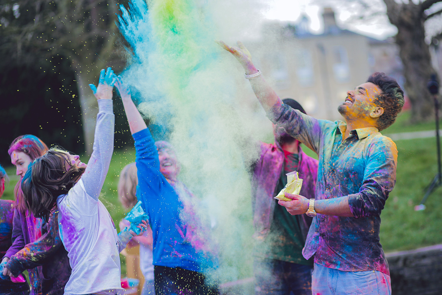Students throwing powder paint for Holi