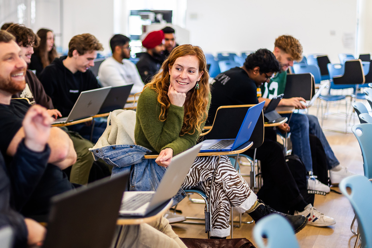 Students talking in a lecture theatre