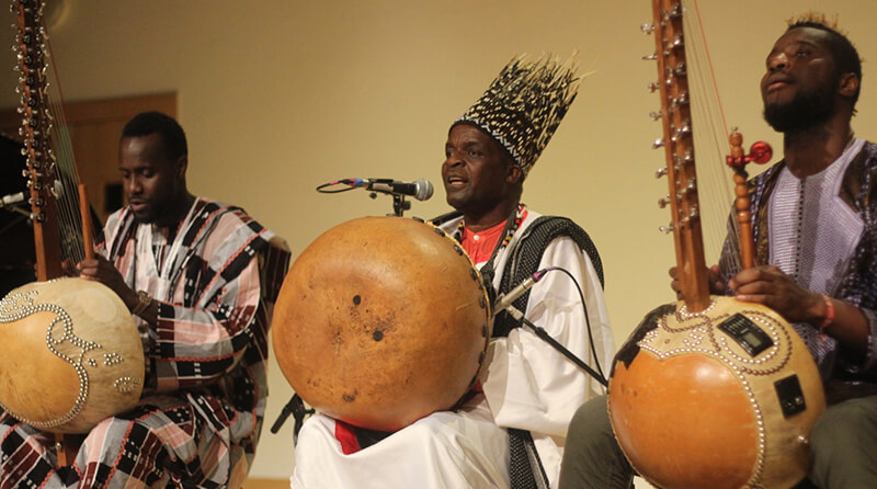 Chartwell performing with two other musicians