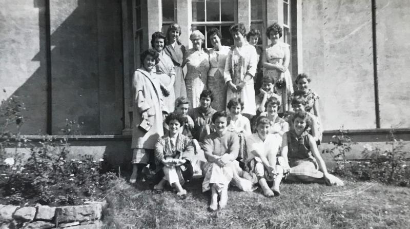 Black and white photo of a group of women gathered outside a Georgian building, Newton Park, 1959