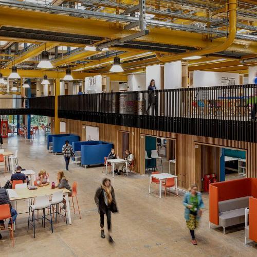 The interior of Locksbrook Campus with students studying in a communal area