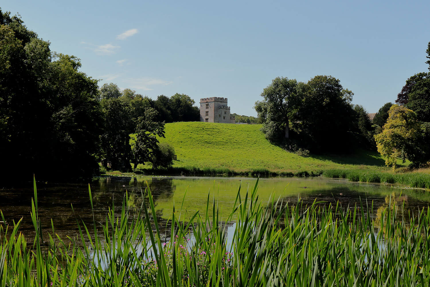 View of the Newton Park castle looking across the lake from the dam