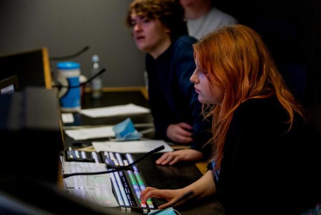 Student and a technician using a TV camera