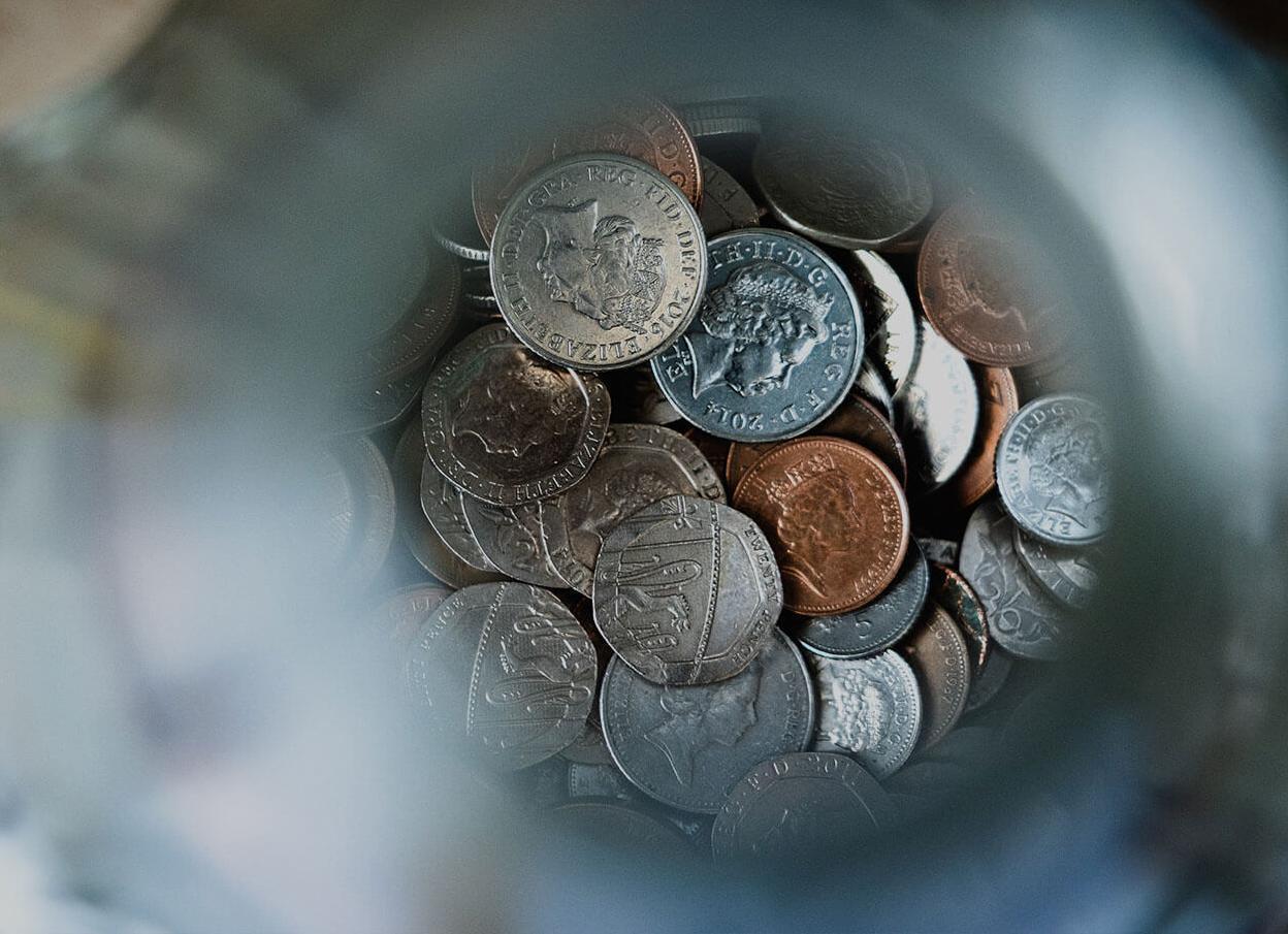 Close up view of coins in a jar