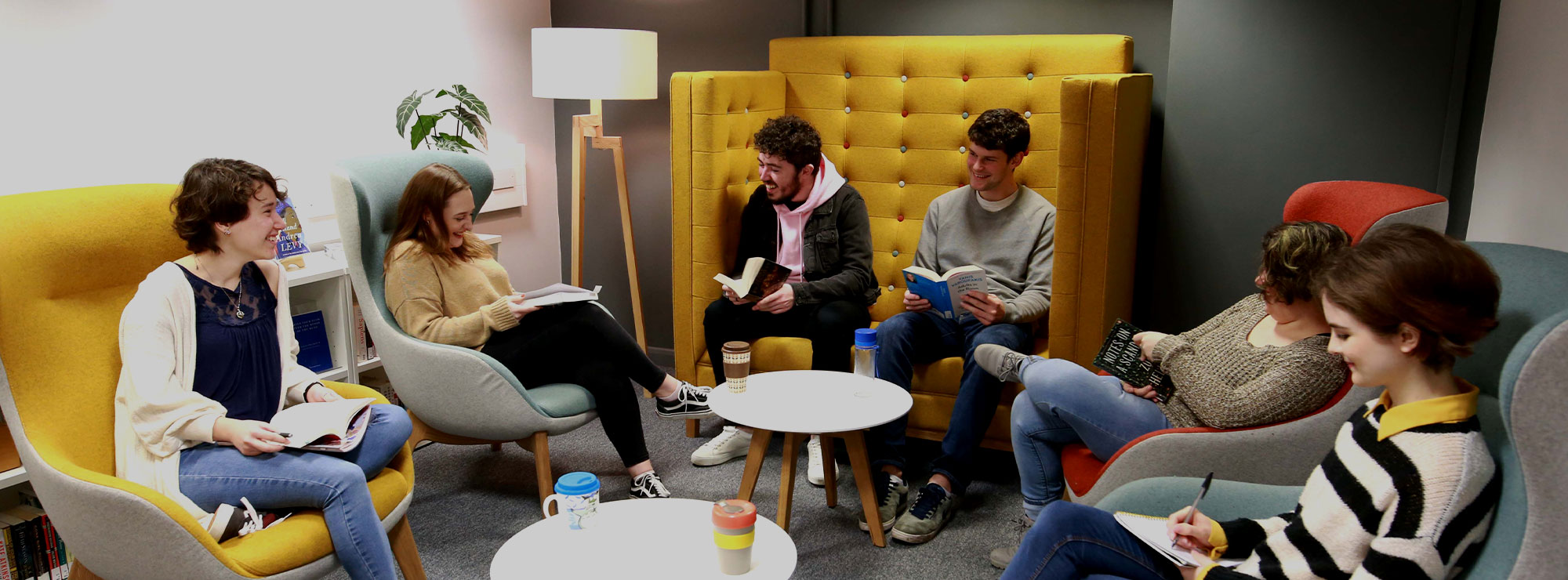 A group of students working together in a study space at Bath Spa