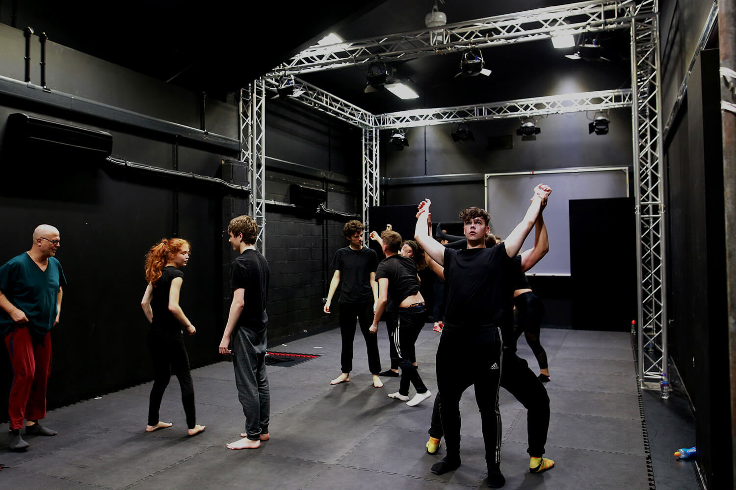 Students practising in a black box space