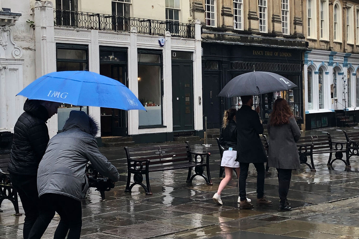 Filming in the rain with Georgian buildings behind
