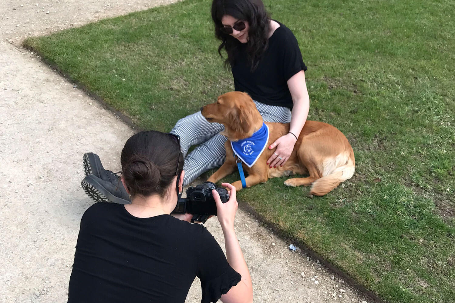 Filming a dog in the sun with a young woman