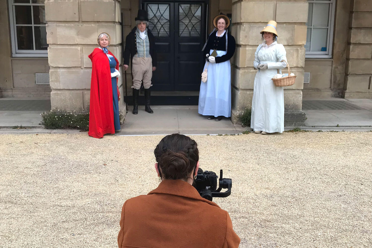 Filming four people in Regency period dress outside a Georgia museum