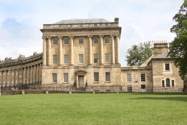 A Georgian building on a green lawn