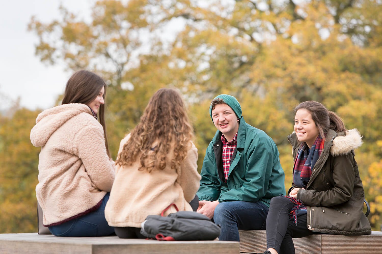 Students sitting outside talking