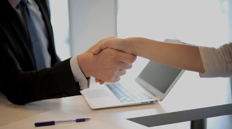 a man and woman shaking hands