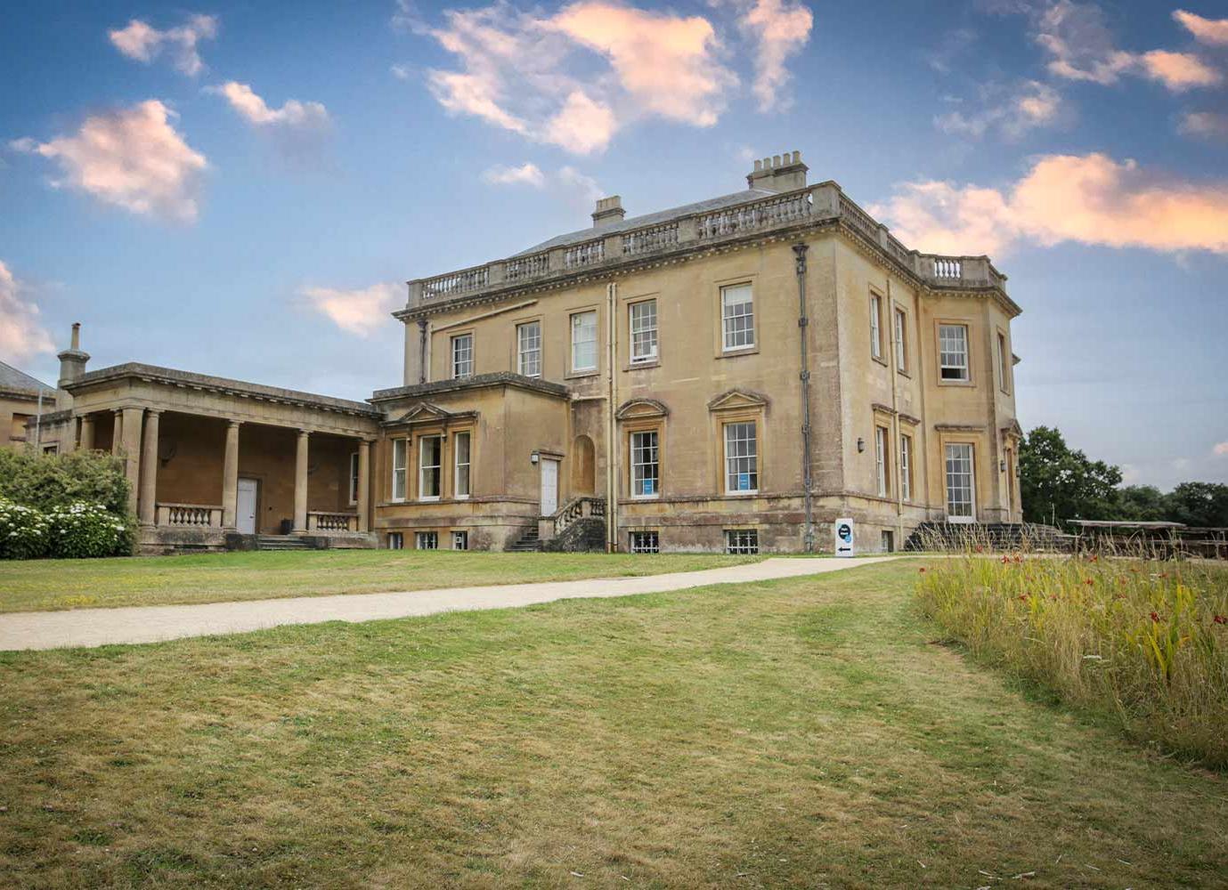 View of main house campus with lightening skies