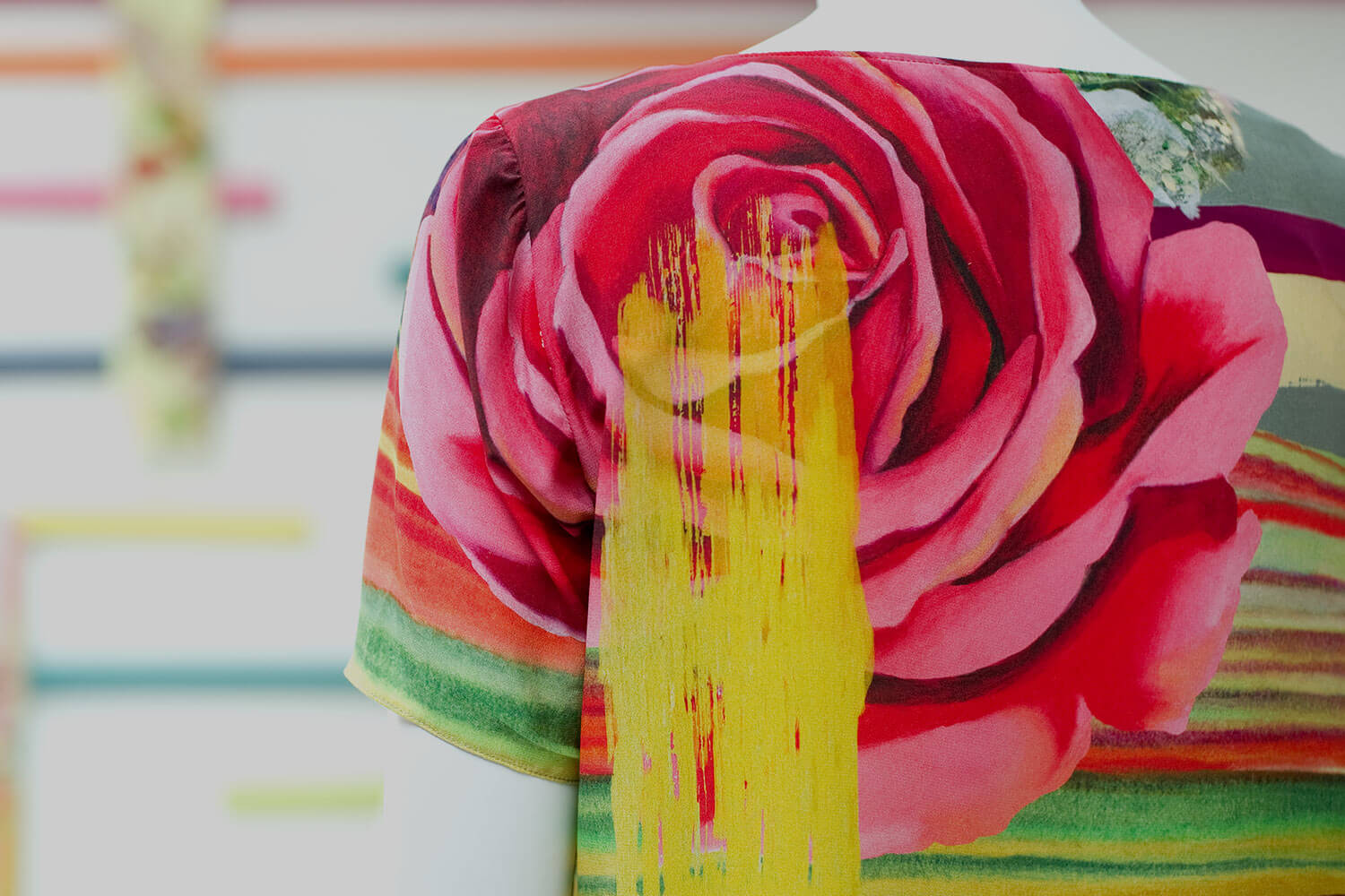 Closeup on a floral print blouse on a mannequin.