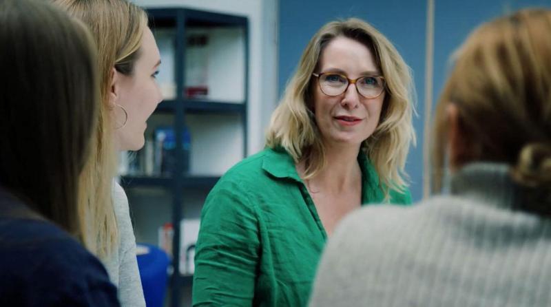 Business and management student in a green blouse