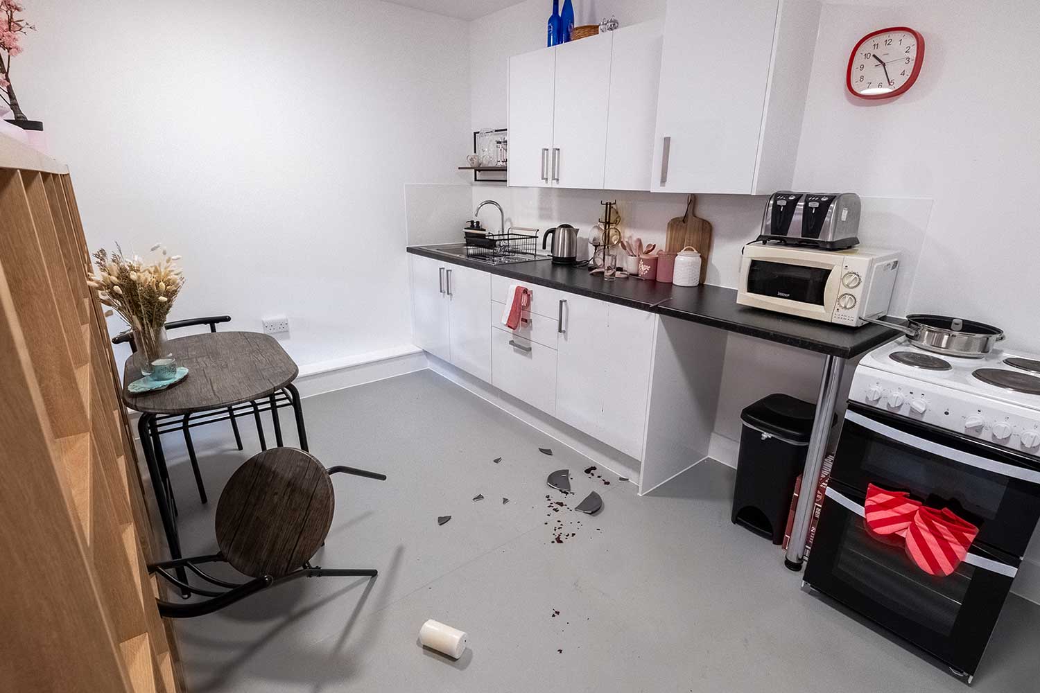 A kitchen set up with fake evidence in a fake crime scene investigation
