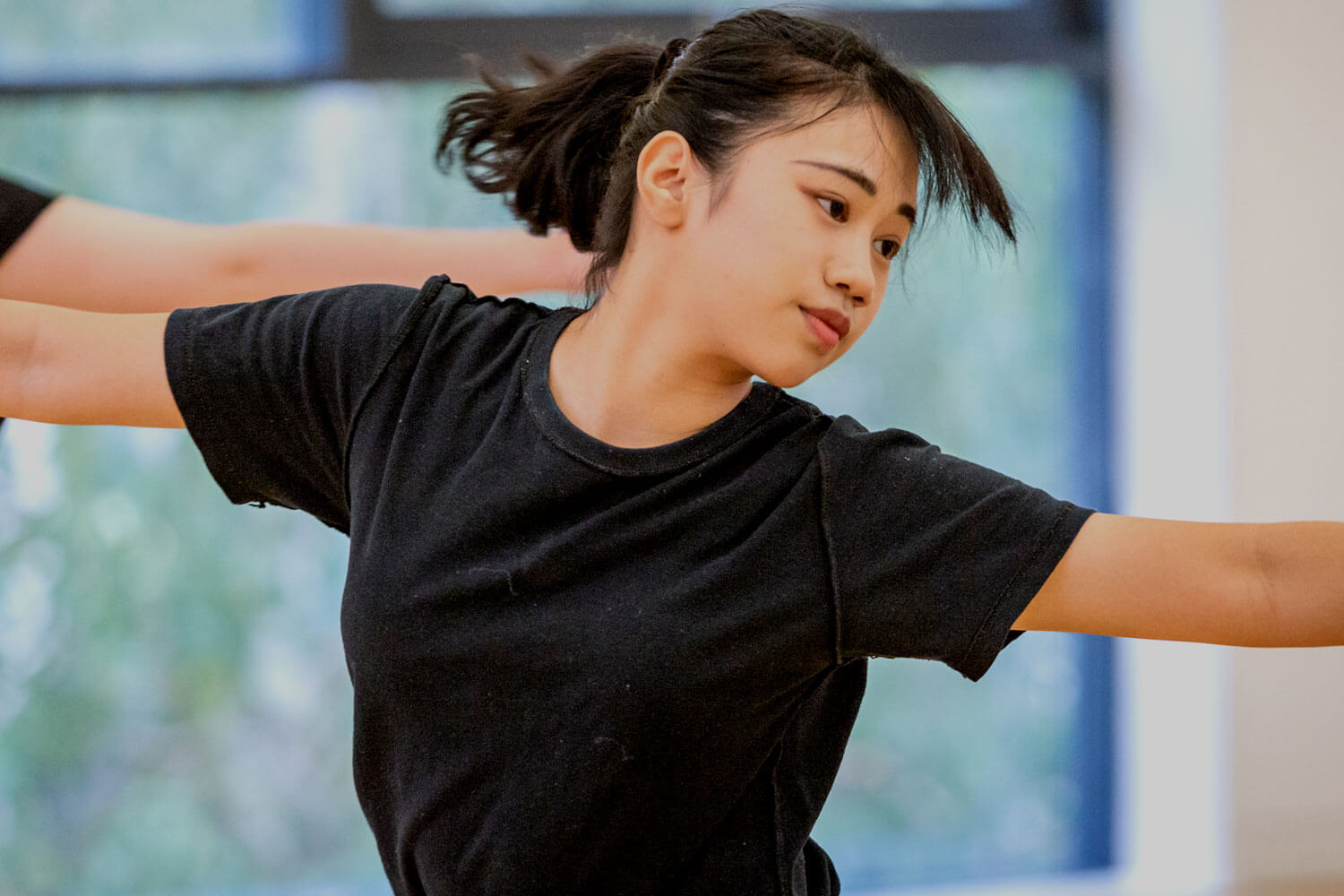 Female dancer in black tshirt dancing