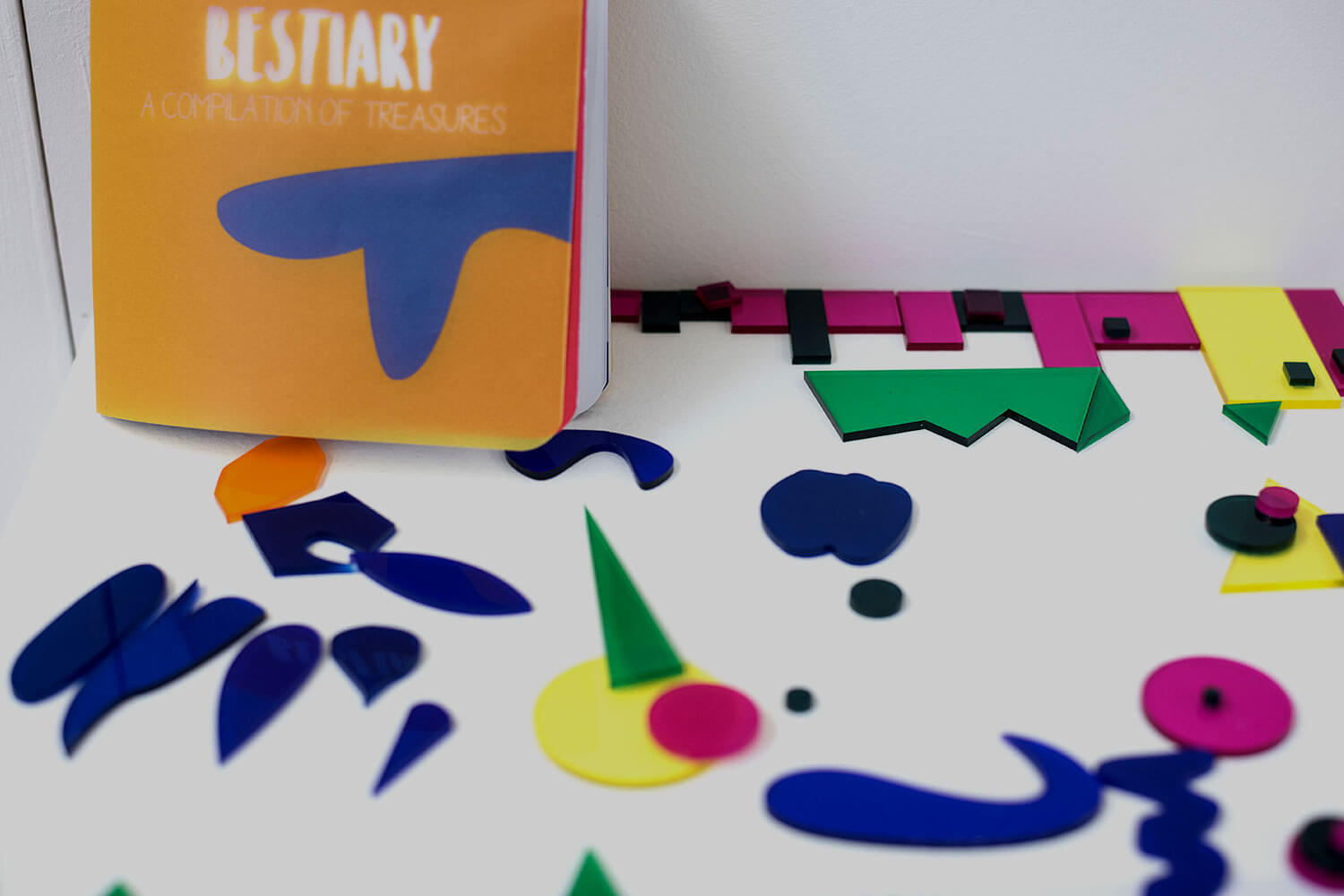 Coloured plastic shapes and graphic book