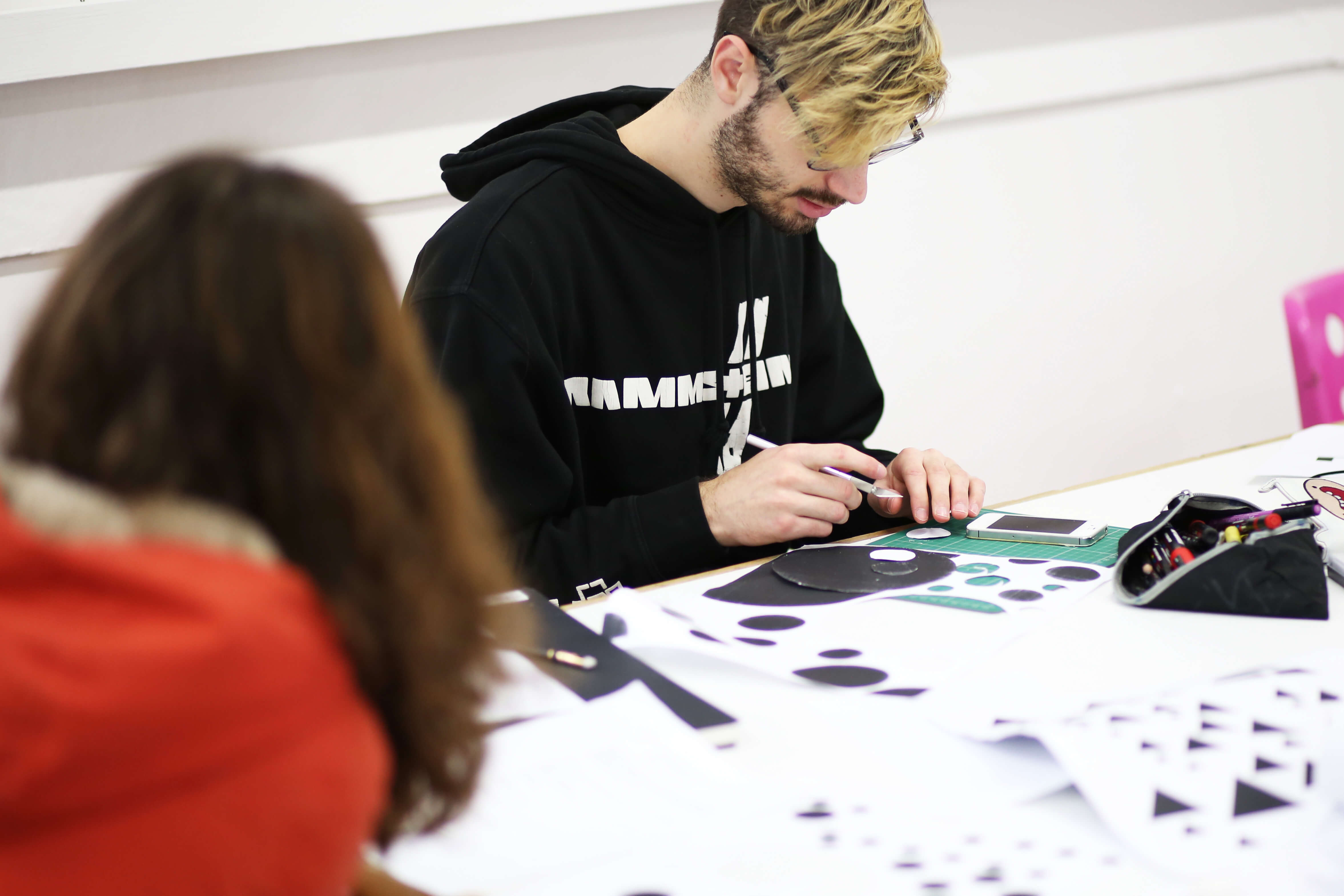 Graphics students working at a table