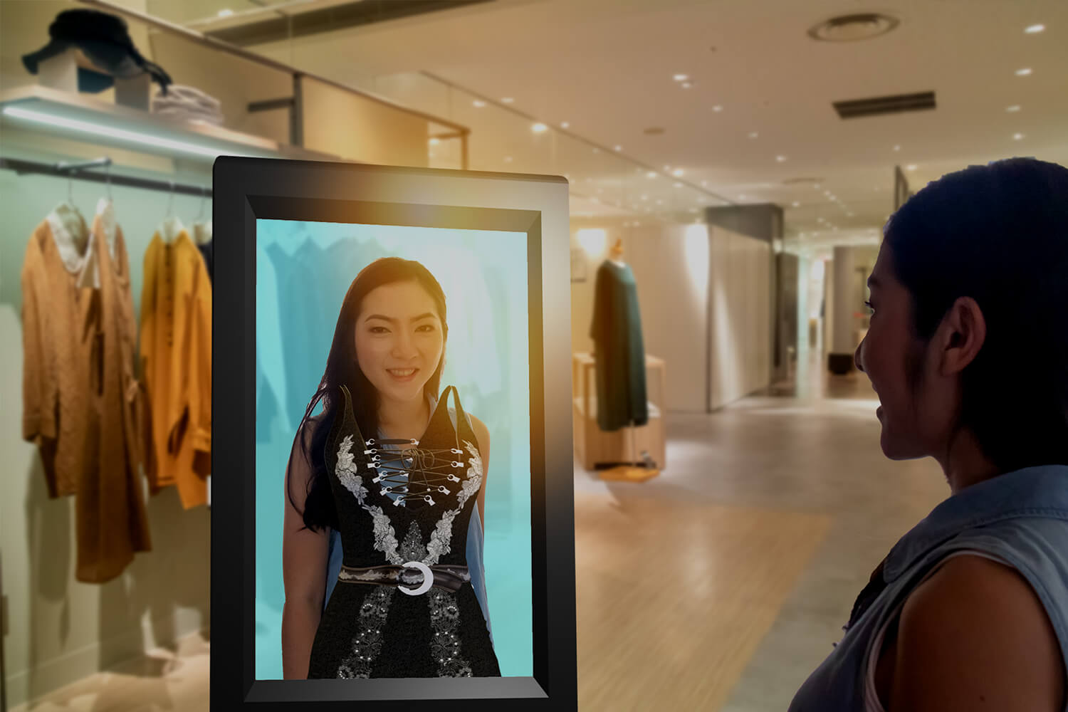 Shopper trying on clothes with an augmented reality smart display.