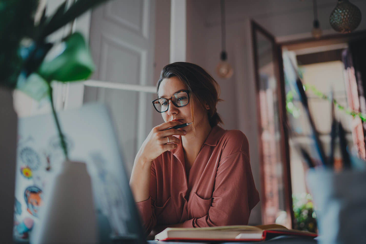 A female entrepreneur checks her laptop