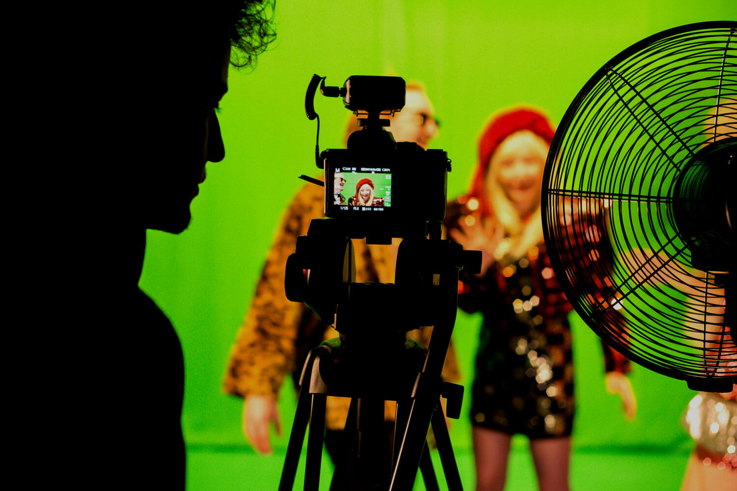 Students in front of and behind the camera