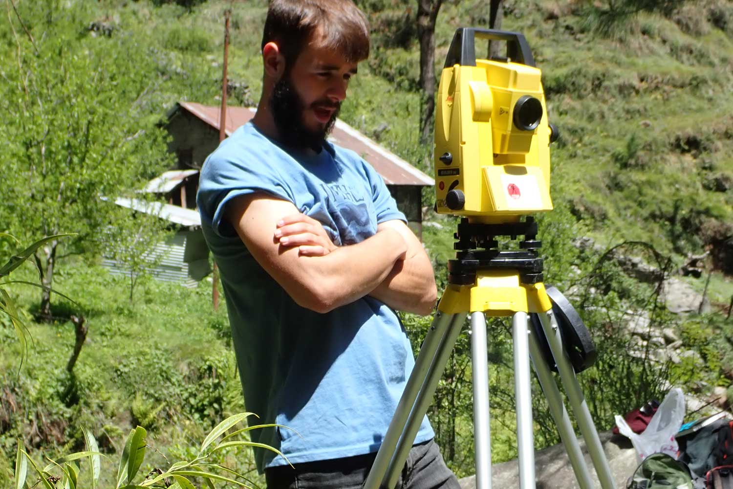 A student operates a piece of equipment on a field trip