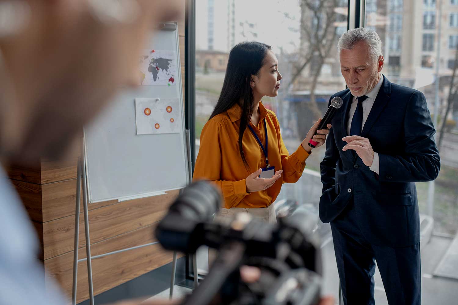 A journalist interviews a businessman