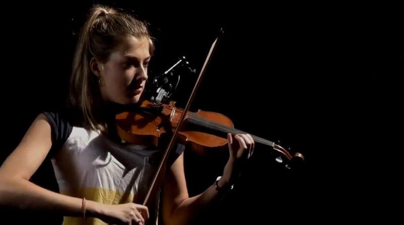 Young woman playing violin