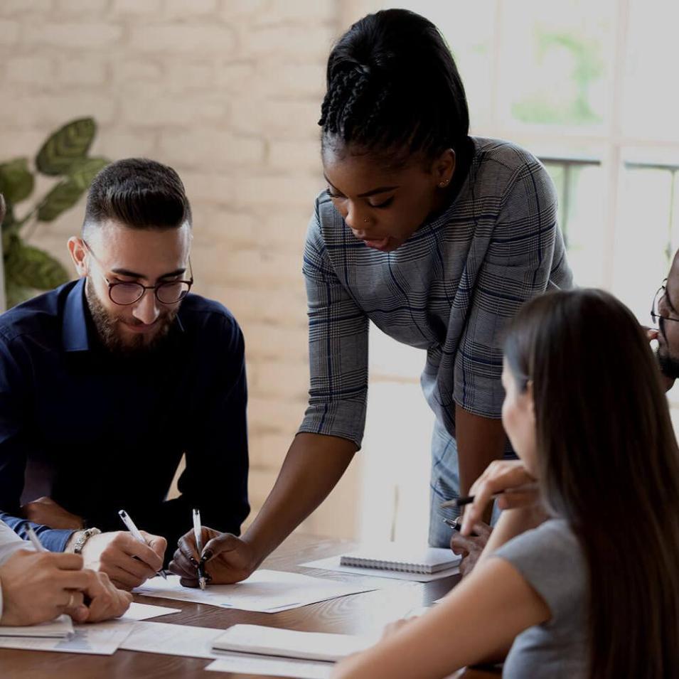 Diverse group of people working together at a table