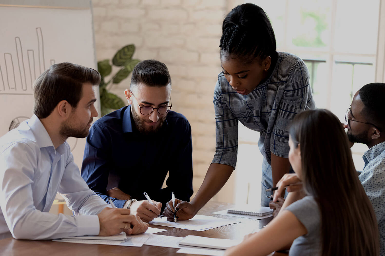 Diverse group of people working together at a table