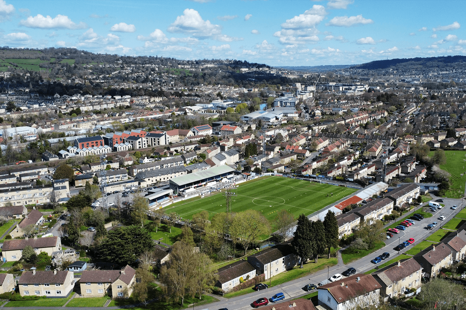 An aerial shot of Twerton Park's football pitch, surrounded by residential housing