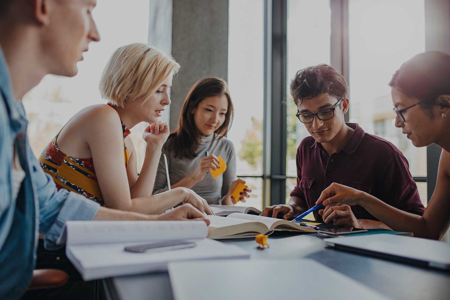 Diverse group of students working together on a project