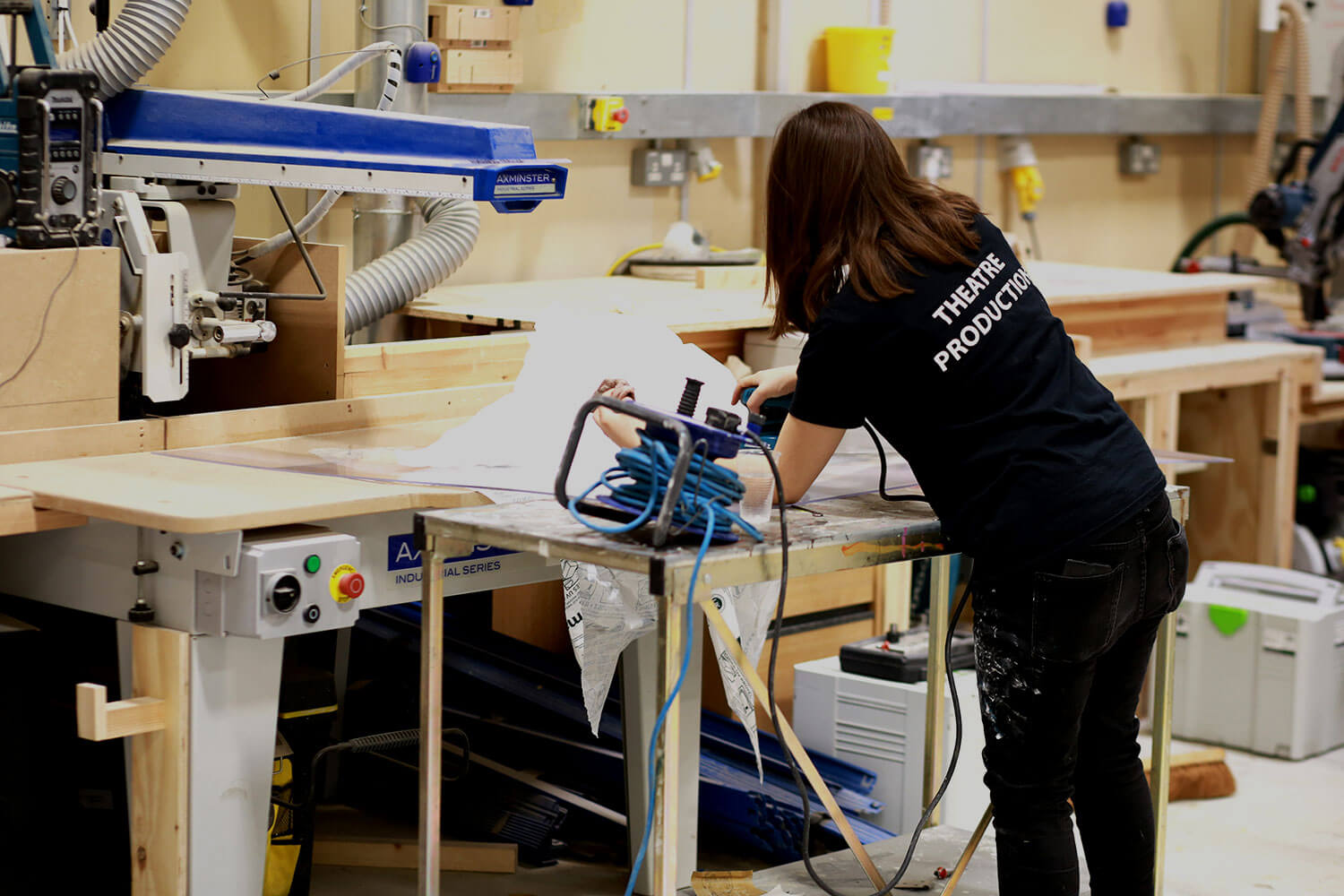 Student constructing theatre set