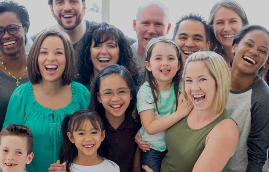 Group of smiling adults and children