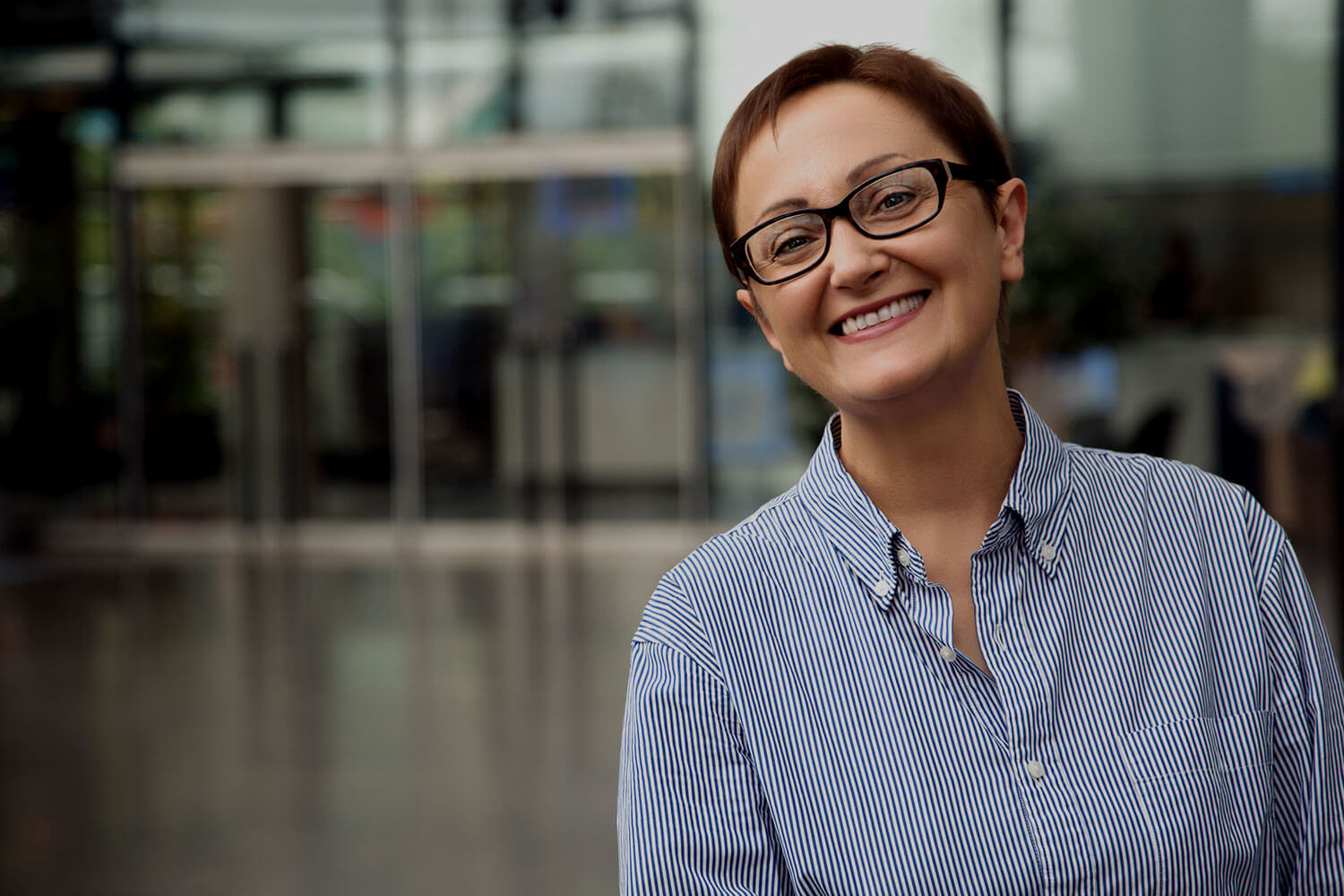 Woman smiling and looking at camera