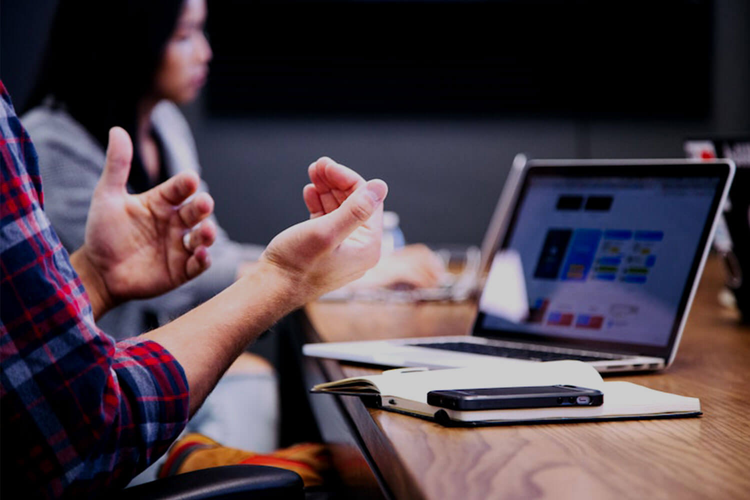 Man's hands in front of a laptop
