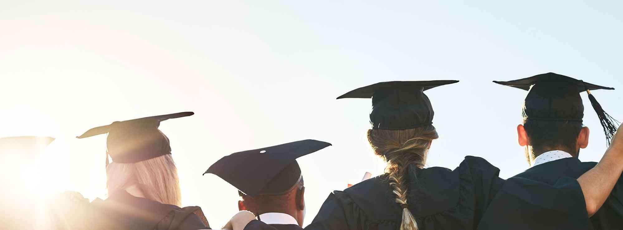 View from behind of line of graduates in robes