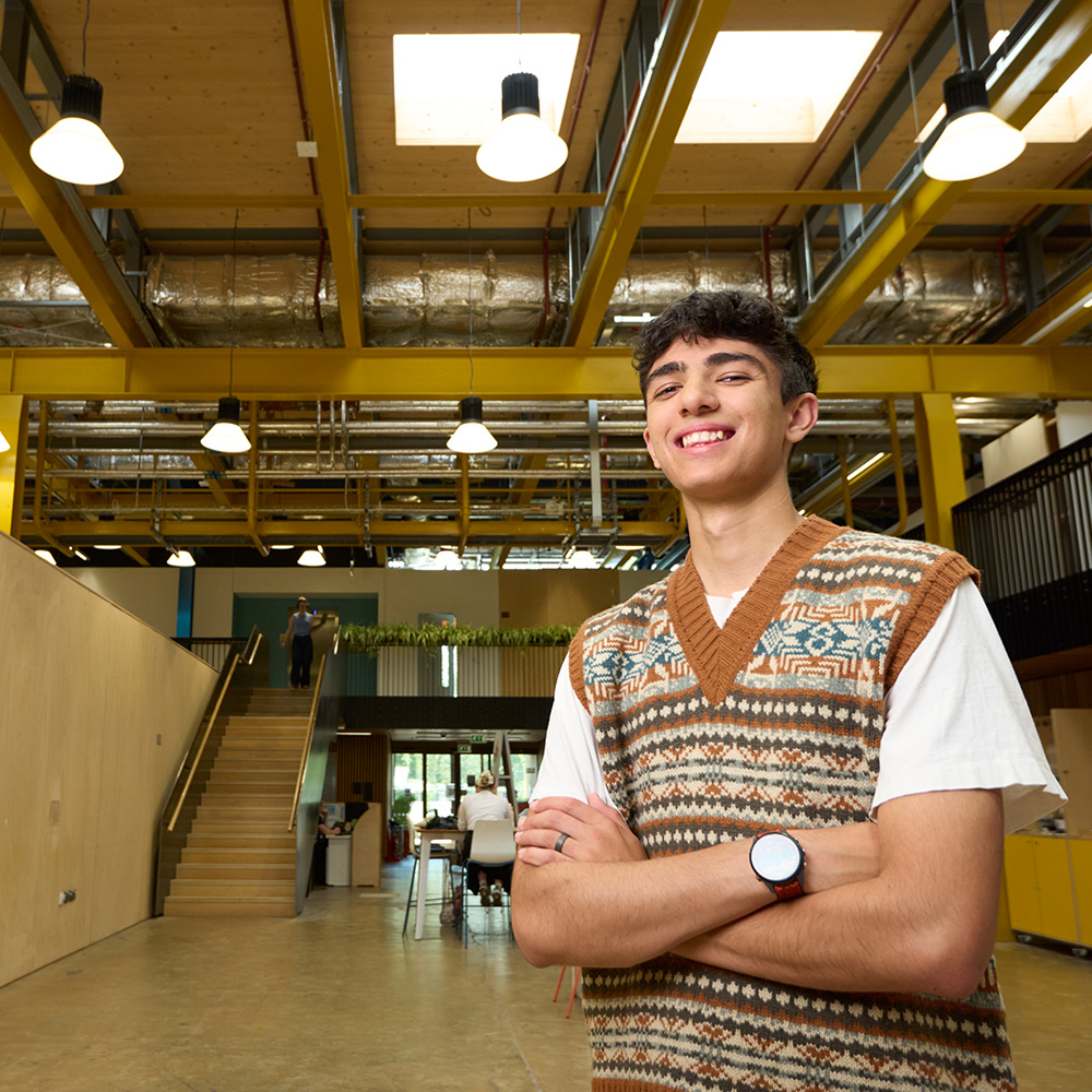 A postgraduate student stands inside Locksbrook
