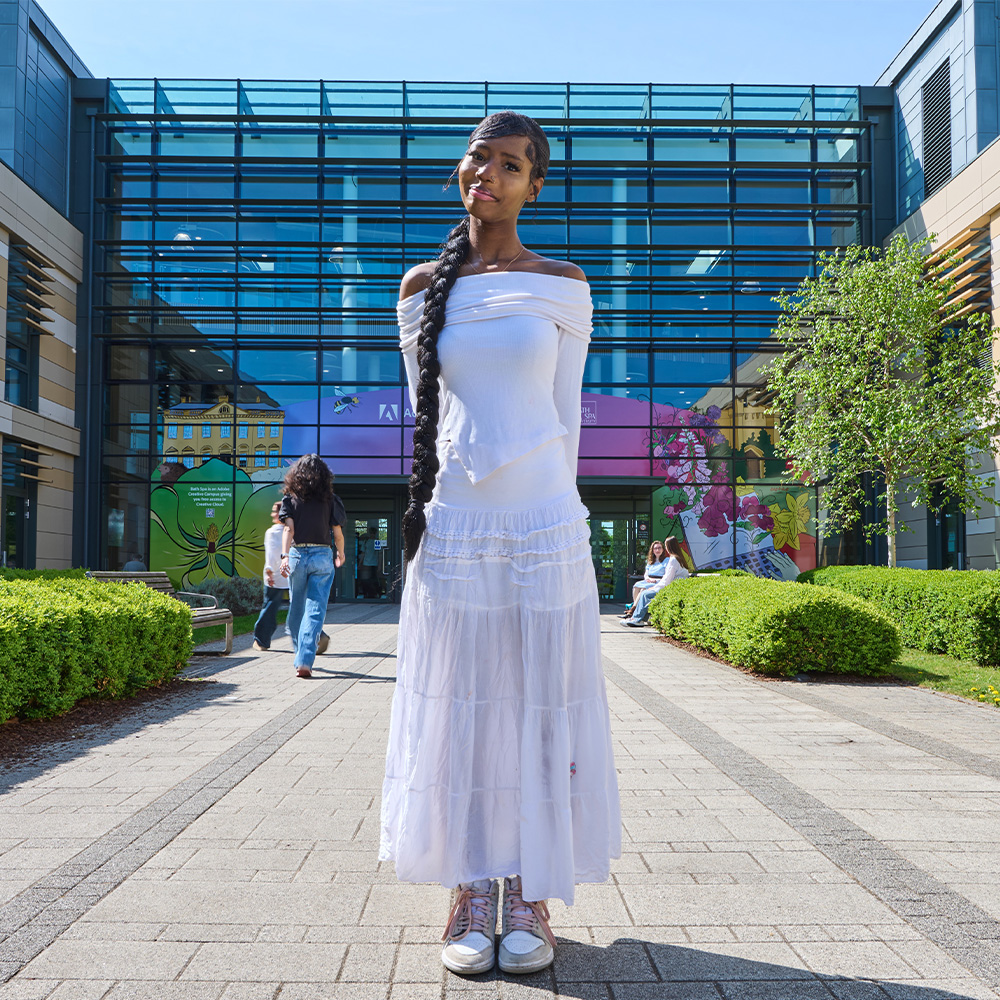 An undergraduate student outside Commons Building