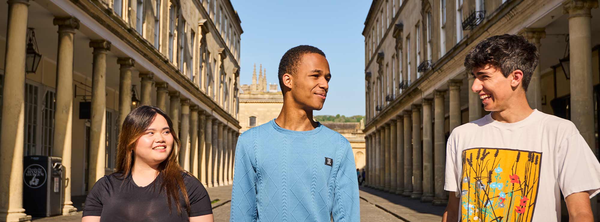 Three young people walking in central Bath