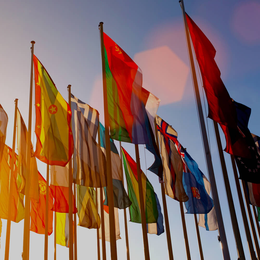 Flags of many different countries waving in the wind